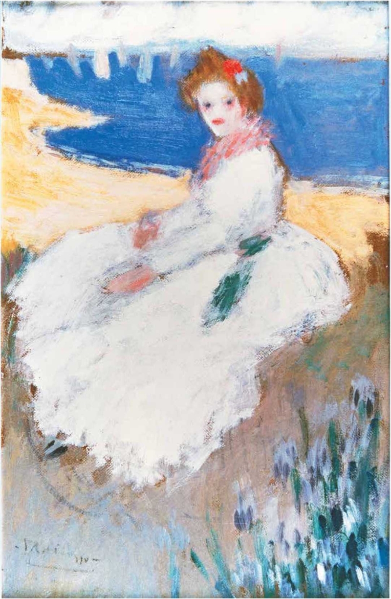 A young woman in a white dress sits by the shore, with a blue sea and sandy beach in the background, surrounded by flowers.