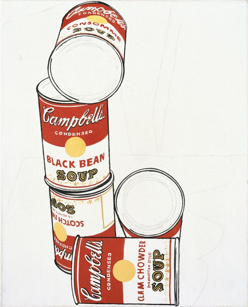 Stacked Campbell's soup cans featuring black bean and clam chowder, with some cans facing upward and others sideways.