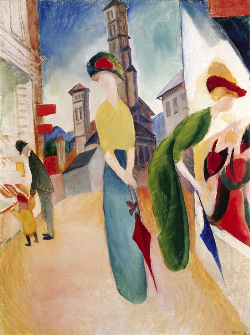 Two elegantly dressed women with umbrellas stand on a street, alongside a man and child, with buildings and a tower in the background.