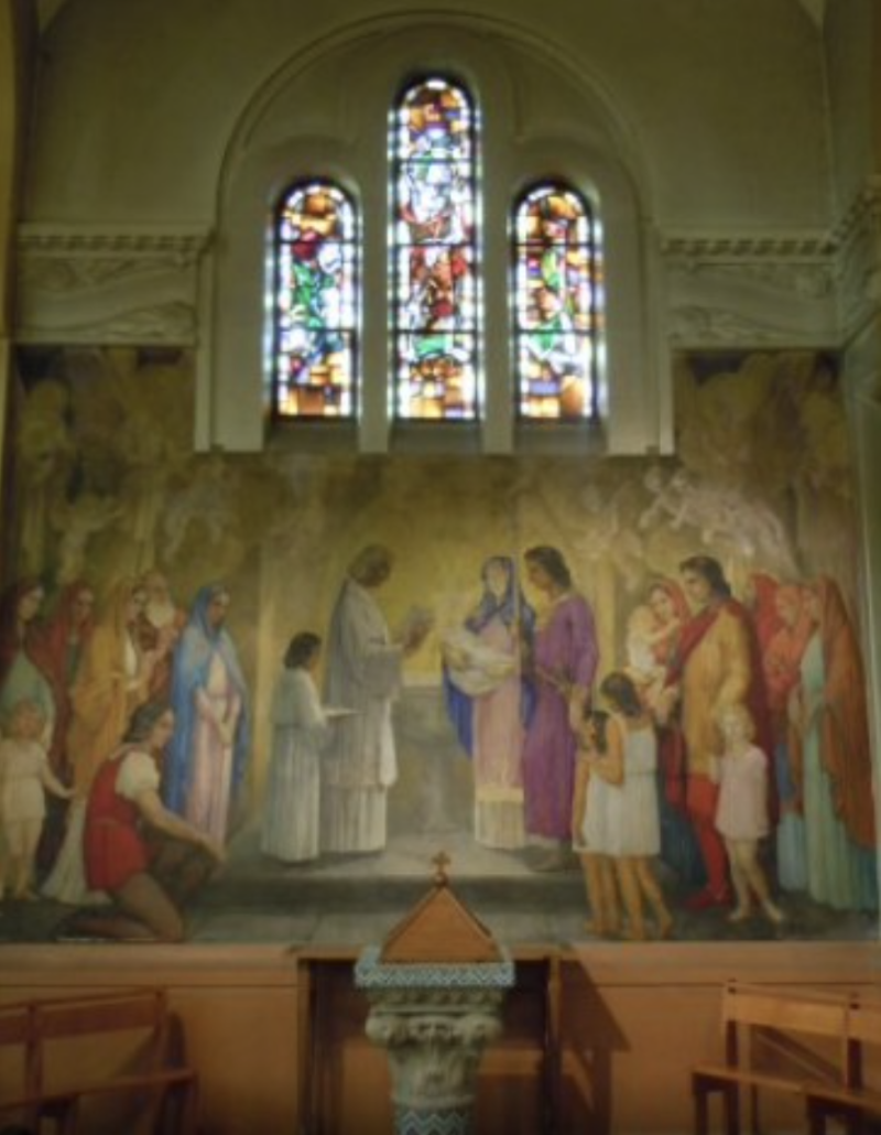 Mural depicting the baptism of Saint Dominic, with figures in colorful robes, a priest, and stained glass windows above.
