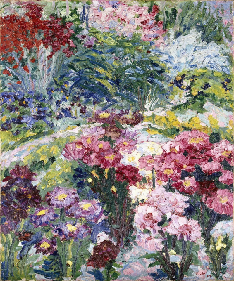Das Bild zeigt einen bunten Blumengarten. Überall blühen rote, rosa, violette und gelbe Blumen. Man sieht sie in dichten Gruppen – nah beieinander, wie in einem wilden, lebendigen Garten.
Die Farben sind kräftig und leuchtend, mit vielen dicken Pinselstrichen. Die Blumen sind nicht ganz genau gemalt, sondern eher mit Gefühl und Bewegung. Man erkennt, dass es Nolde um die Stimmung ging – nicht um exakte Details.
Im Hintergrund sieht man noch mehr Blumen und grüne Blätter.