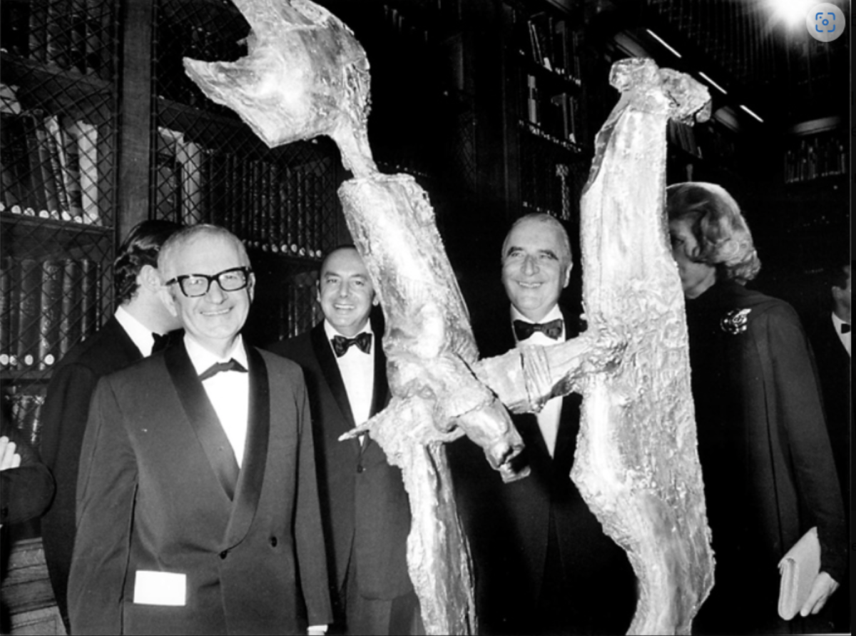 Bernard Lorjou stands with a silver sculpture, "Silver Horseman," alongside three men in tuxedos and a woman in a black dress.
