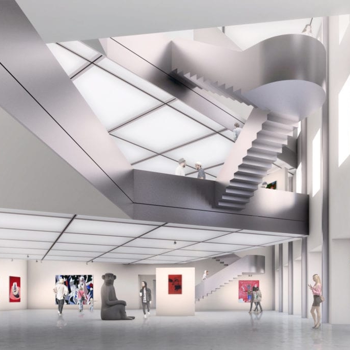 Heidi Horten Collection von innen mit geschwungener Treppe, Kunstwerken an den Wänden und Besuchern im Raum. Helle, offene Architektur.