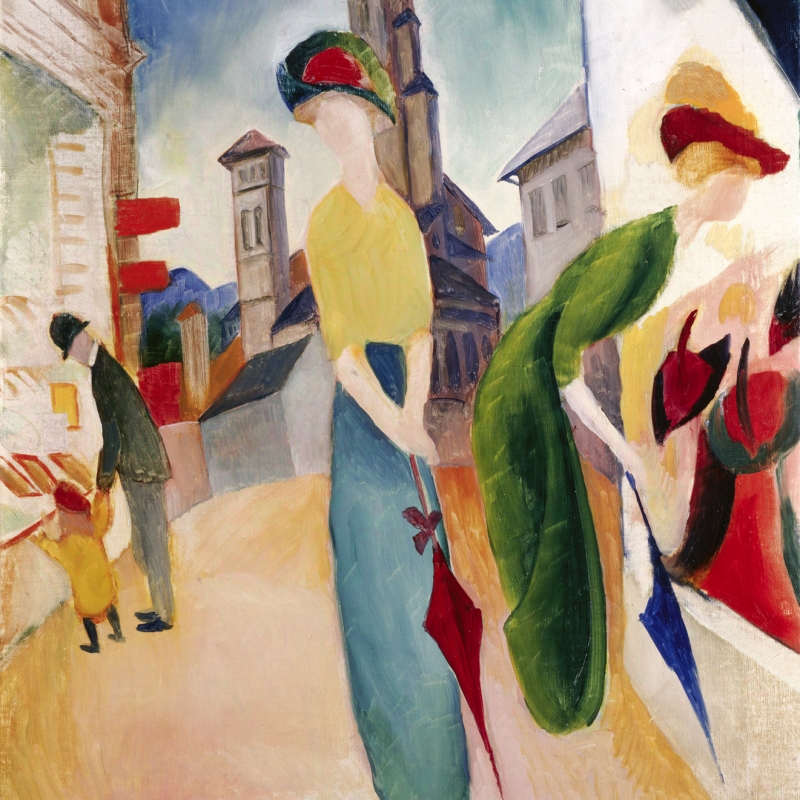 Two elegantly dressed women with umbrellas stand on a street, alongside a man and child, with buildings and a tower in the background.